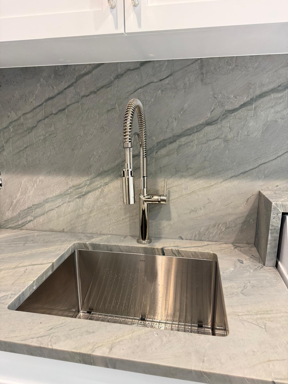 Undermount stainless kitchen sink with an industrial spring faucet