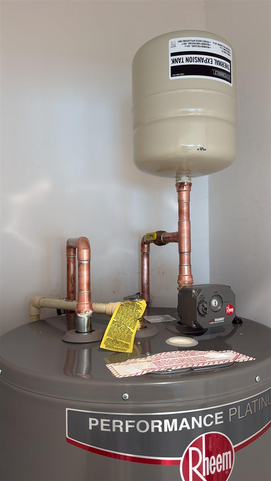 Water heater installation with expansion tank and copper piping